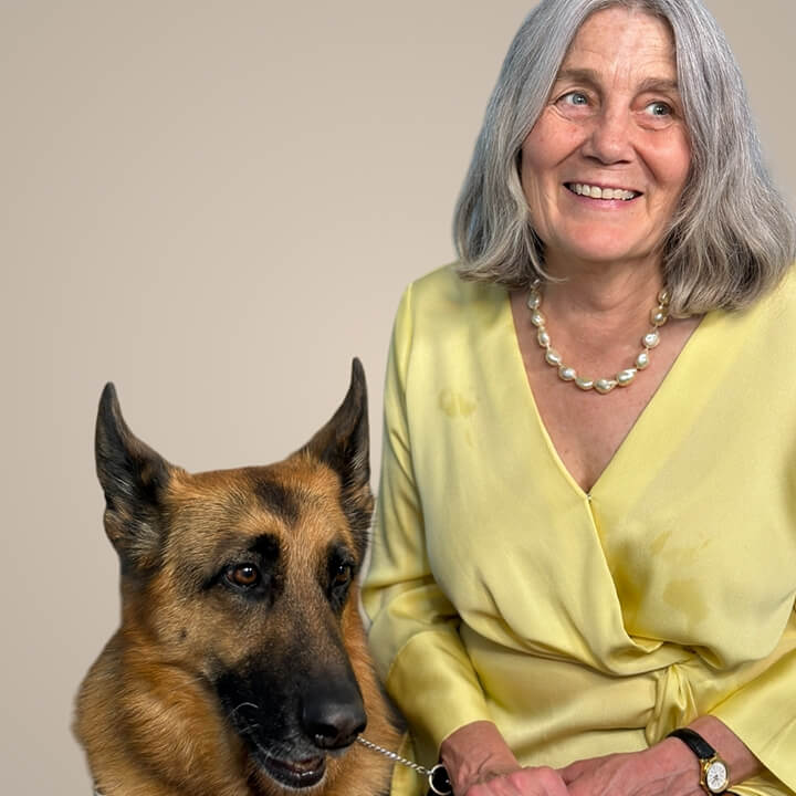 Libbi Lovejoy with her seeing-eye dog, yellow blouse